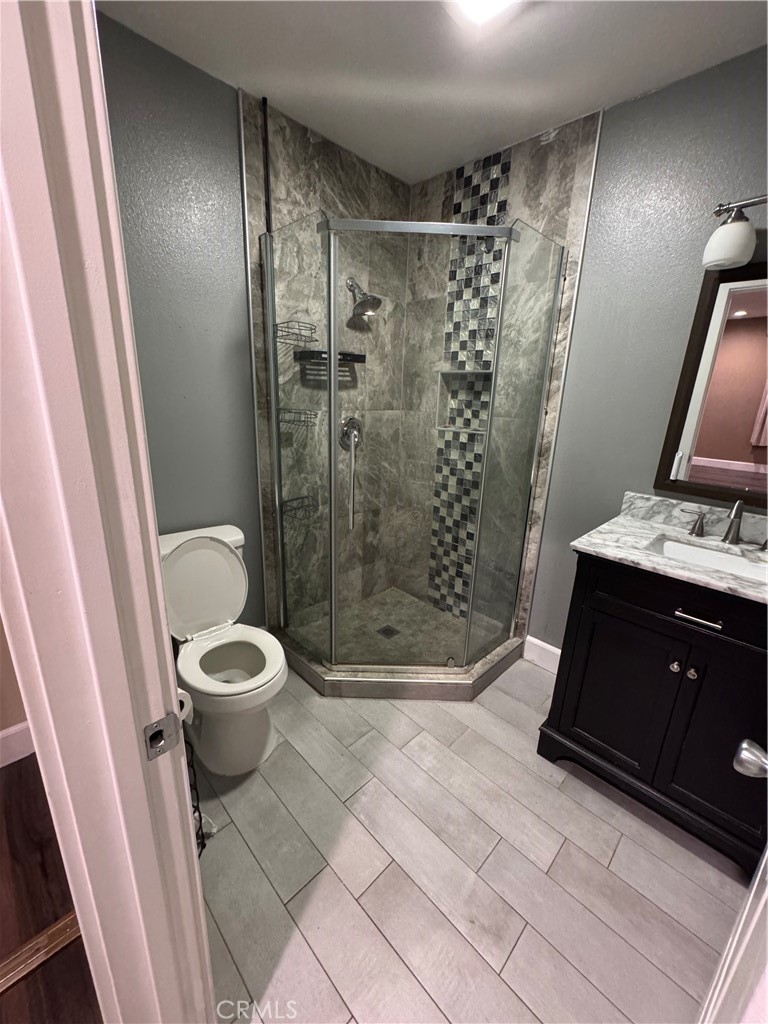 1370 Wheaton Way Riverside, CA 92507 - Photo 8 of 17 a bathroom with a toilet and a shower