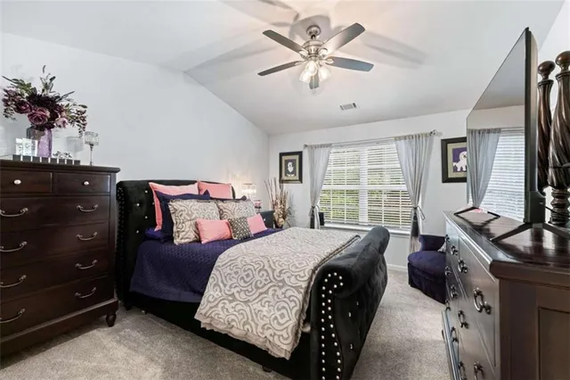 a bed room with a bed and a window