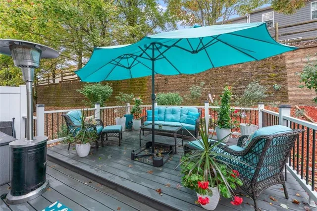 a view of backyard with outdoor seating and plants