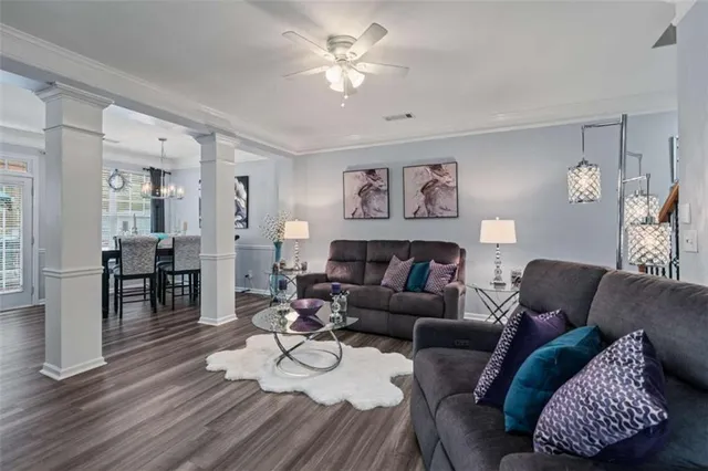 a view of a dining room with furniture window and wooden floor