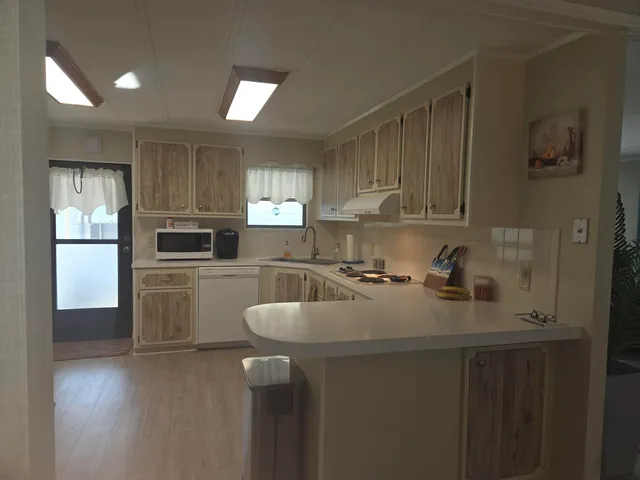 a bedroom with a bed and painting on the wall