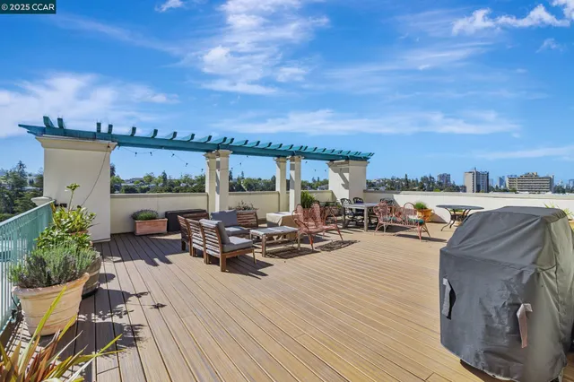 a view of a terrace with furniture and stove