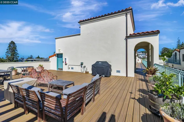 a terrace of a house with outdoor seating