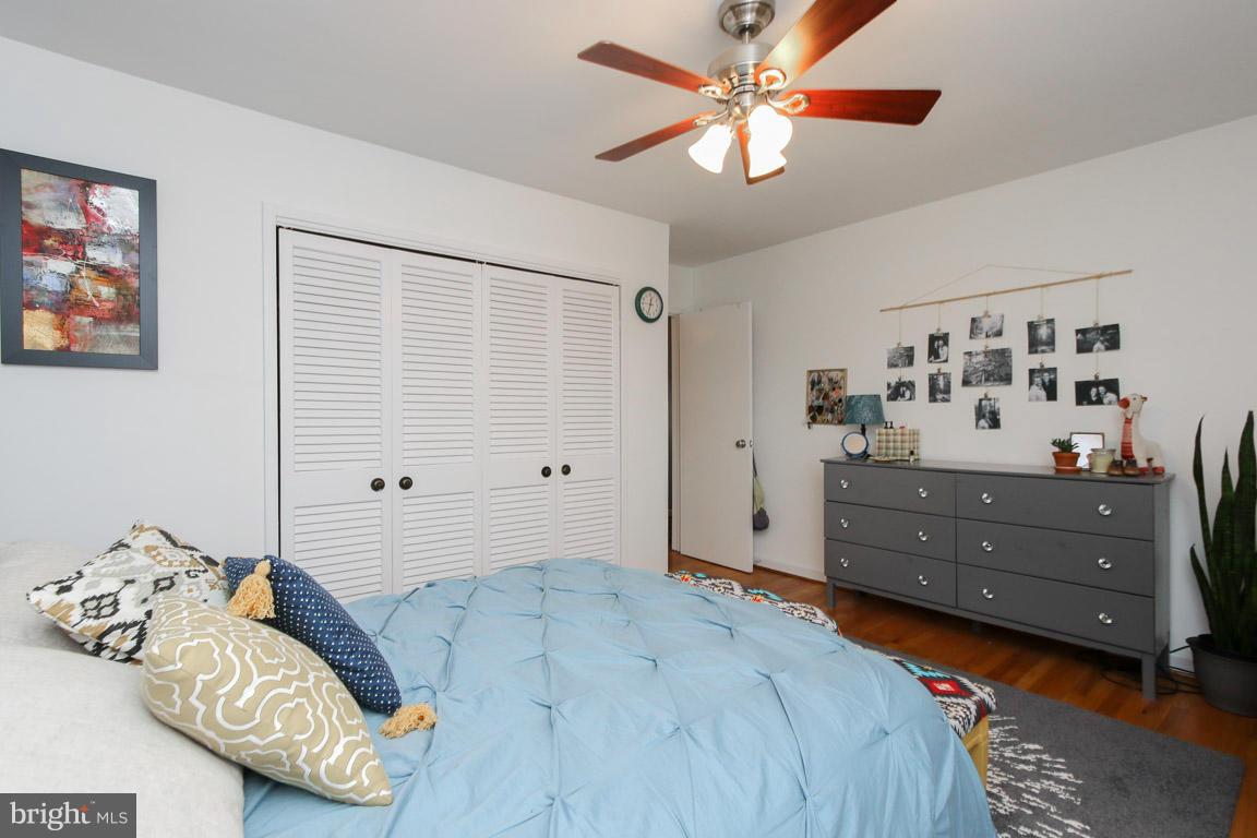 417 Kerwin Road Silver Spring, MD 20901 - Photo 18 of 30 a bedroom with a bed and a chandelier