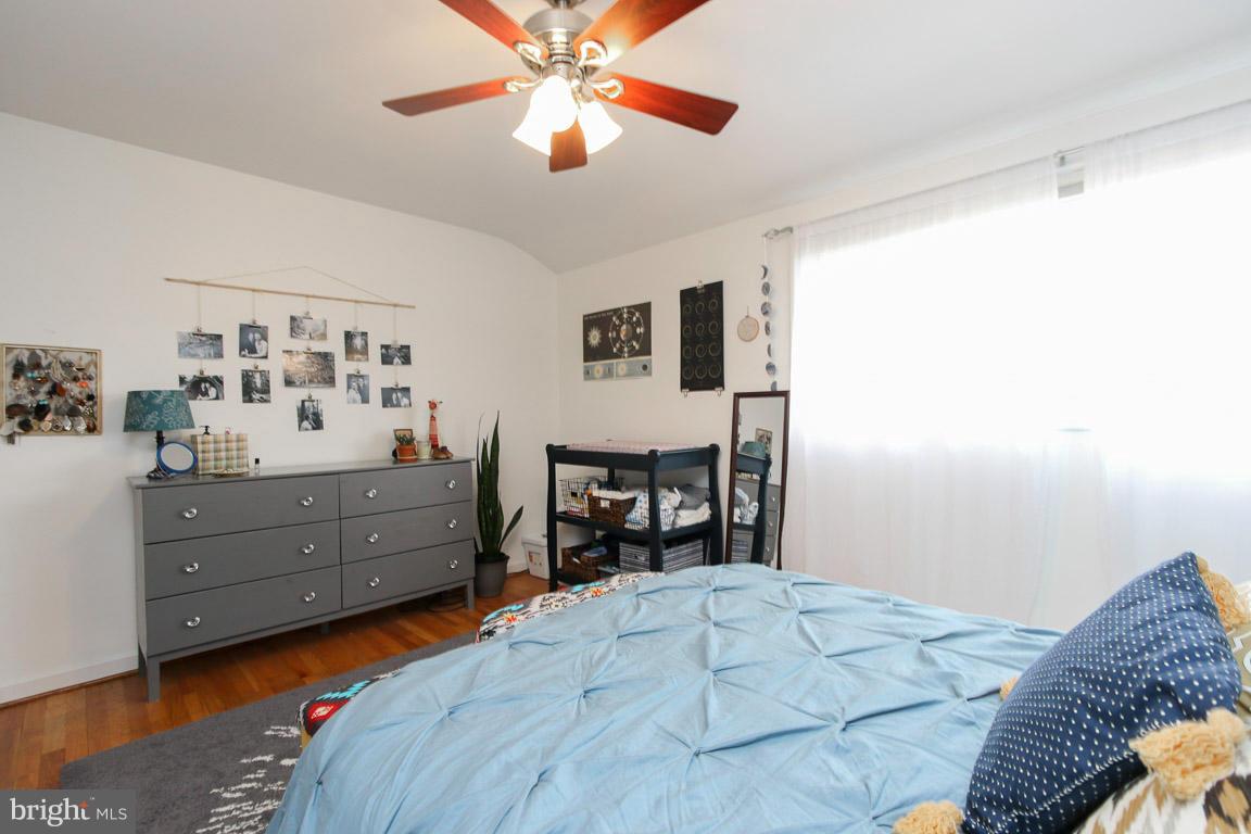 417 Kerwin Road Silver Spring, MD 20901 - Photo 19 of 30 a bedroom with a bed and ceiling fan