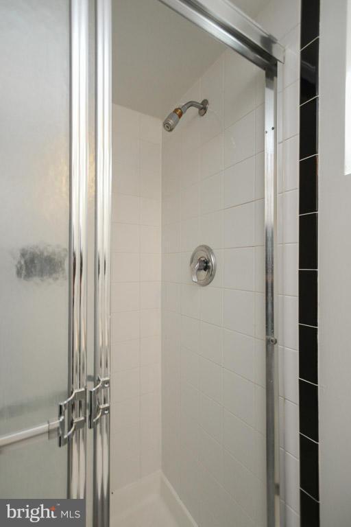 417 Kerwin Road Silver Spring, MD 20901 - Photo 26 of 30 a bathroom with a glass shower door