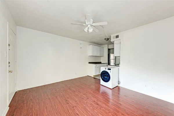 a view of kitchen and wooden floor