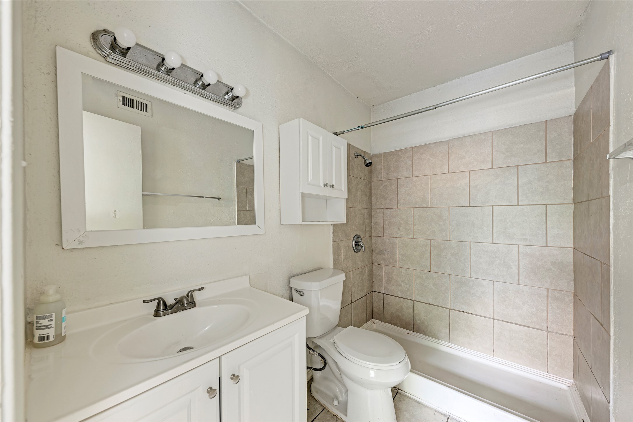 1010 West 23rd Street, Unit 5 Austin, TX 78705 - Photo 10 of 10 a bathroom with a sink mirror toilet and shower