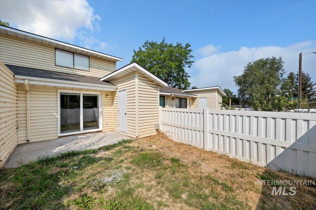 259 Pheasant Road West, Unit 3 Twin Falls, ID 83301 - Photo 18 of 24 Back of property featuring a patio and roof with shingles