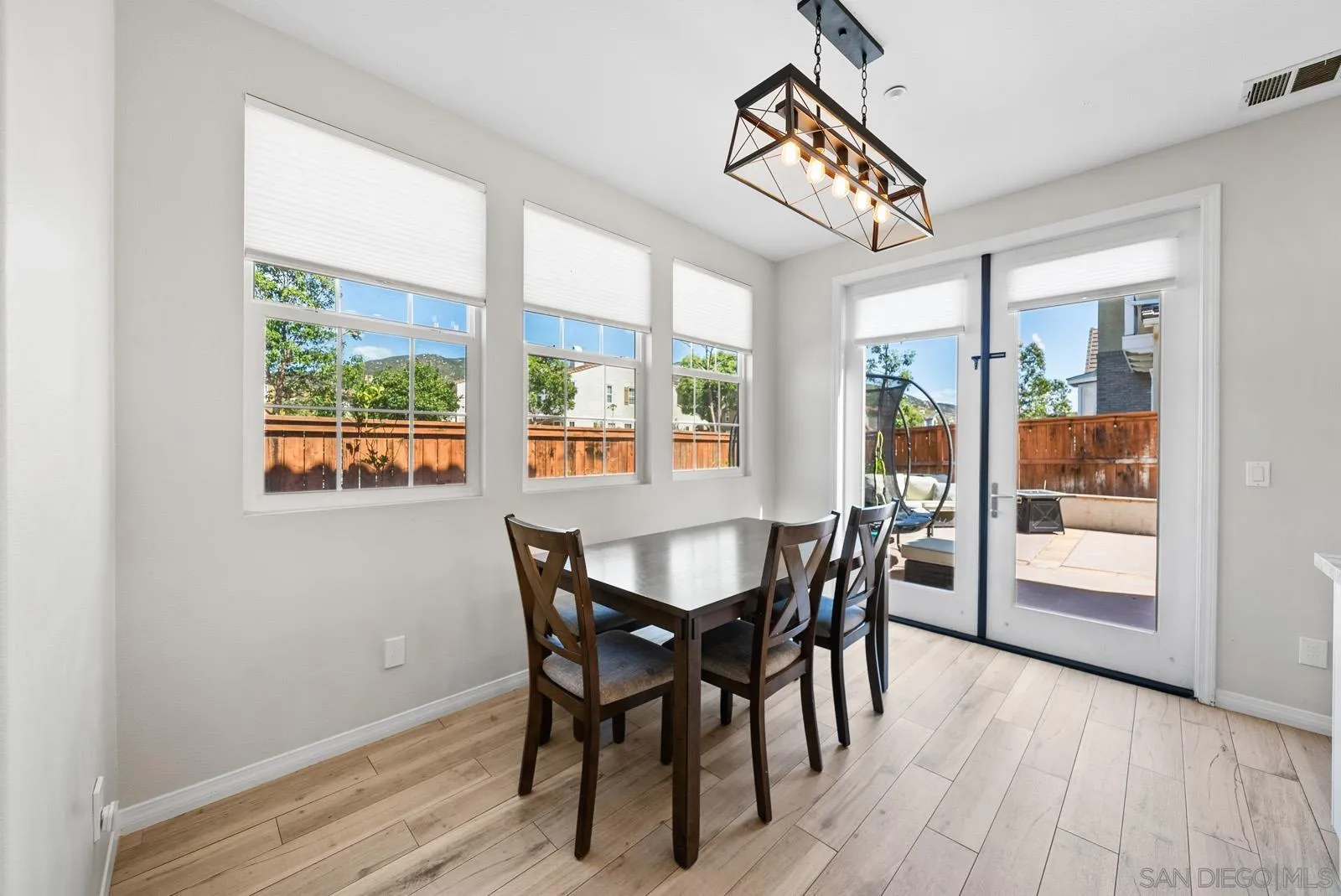 17083 Ralphs Ranch Road San Diego, CA 92127 - Photo 11 of 61 a view of a dining room with furniture and window