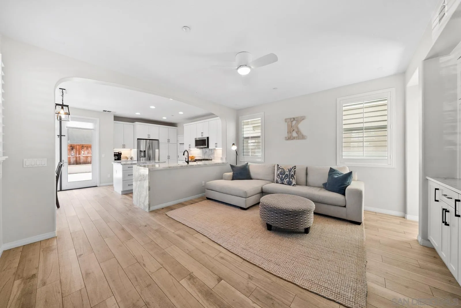 17083 Ralphs Ranch Road San Diego, CA 92127 - Photo 13 of 61 a living room with furniture and a wooden floor