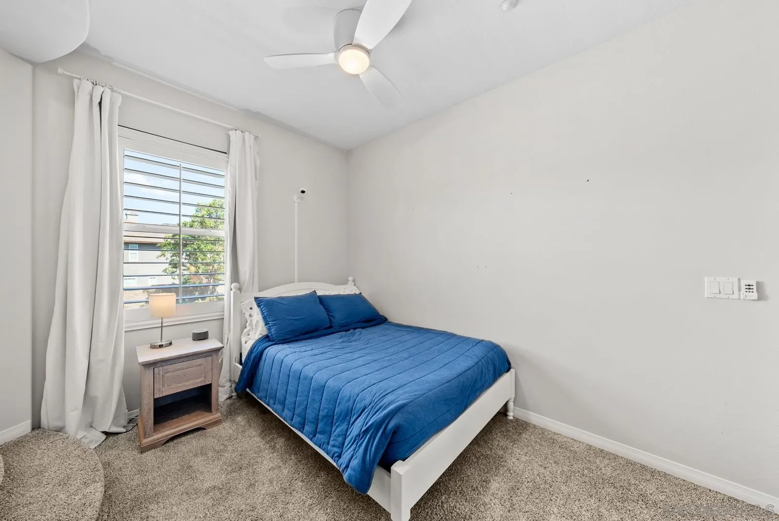 17083 Ralphs Ranch Road San Diego, CA 92127 - Photo 22 of 61 a bedroom with a bed and a window