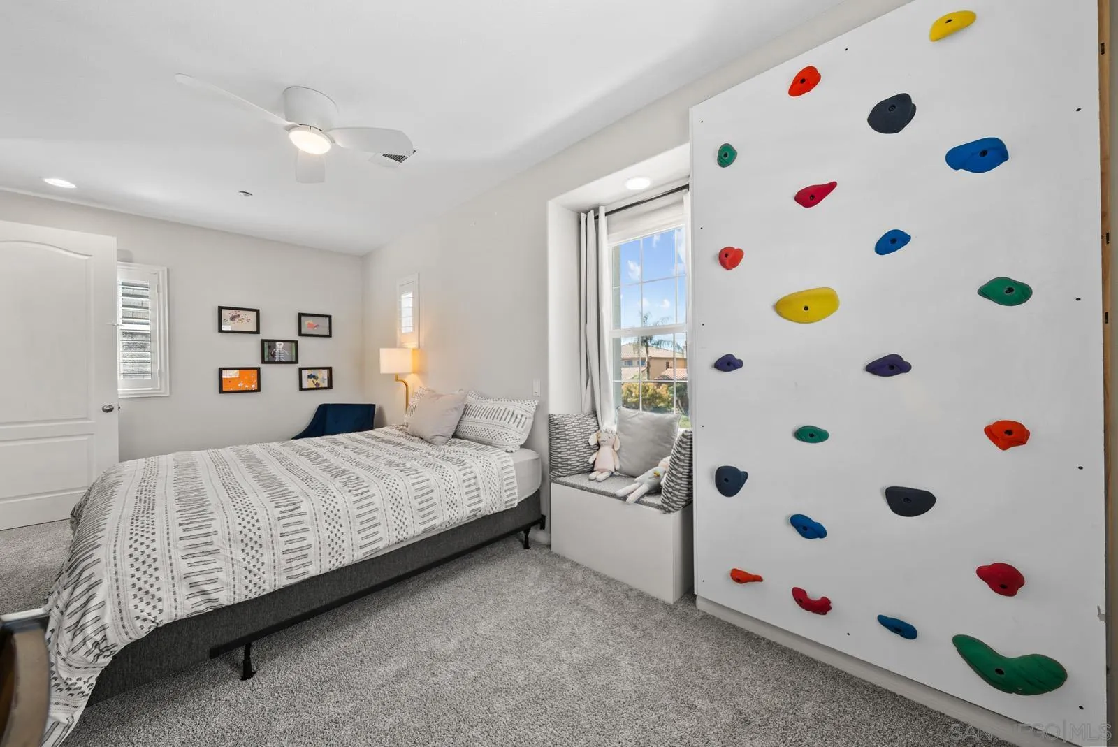 17083 Ralphs Ranch Road San Diego, CA 92127 - Photo 27 of 61 a bedroom with a bed and a window