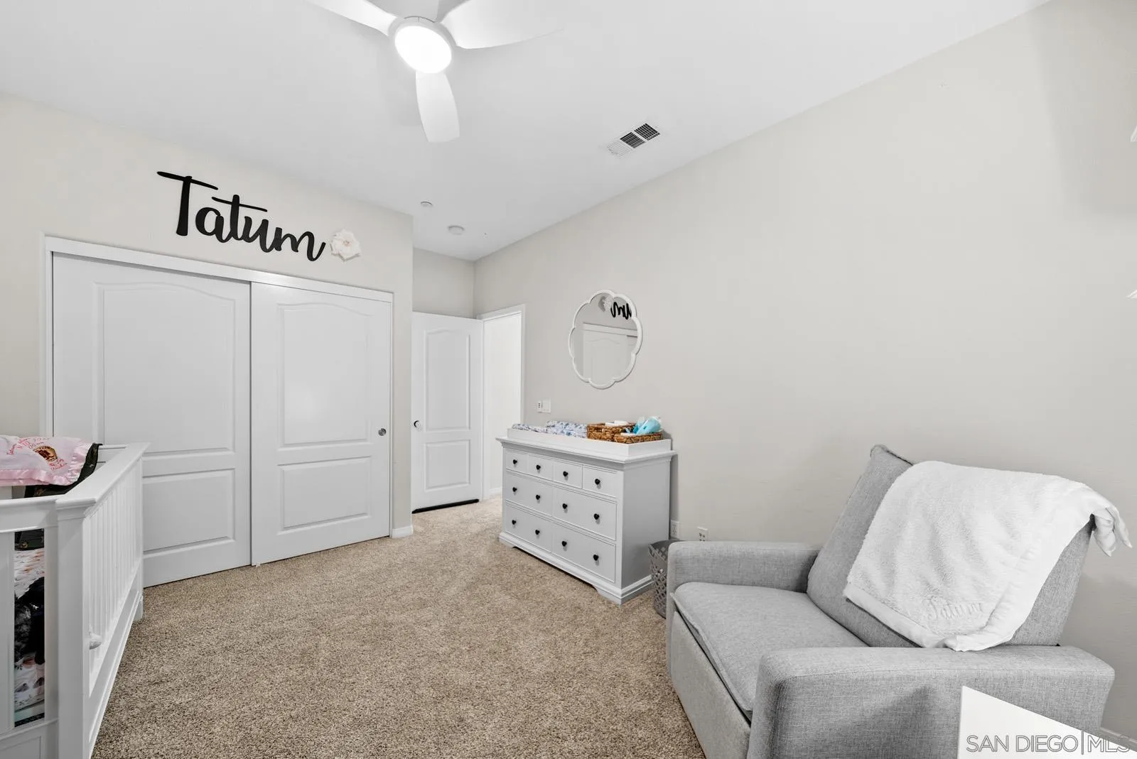 17083 Ralphs Ranch Road San Diego, CA 92127 - Photo 30 of 61 a living room with furniture and a baby crib