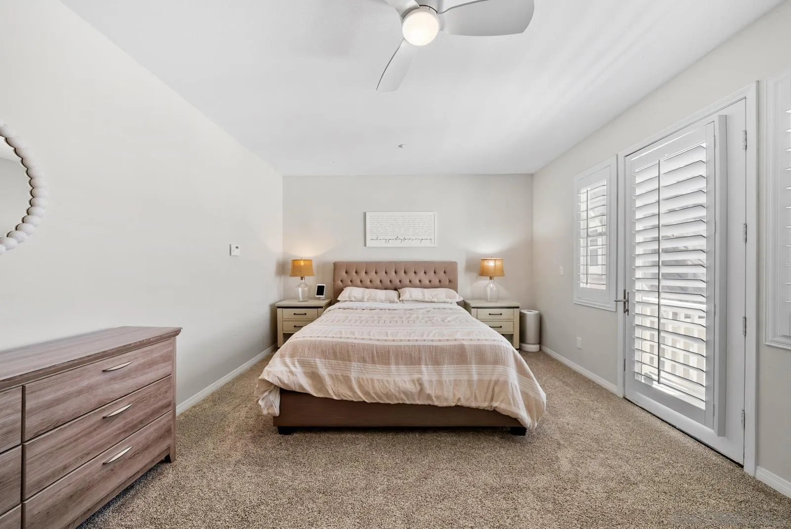 17083 Ralphs Ranch Road San Diego, CA 92127 - Photo 33 of 61 a spacious bedroom with a bed and a cabinets