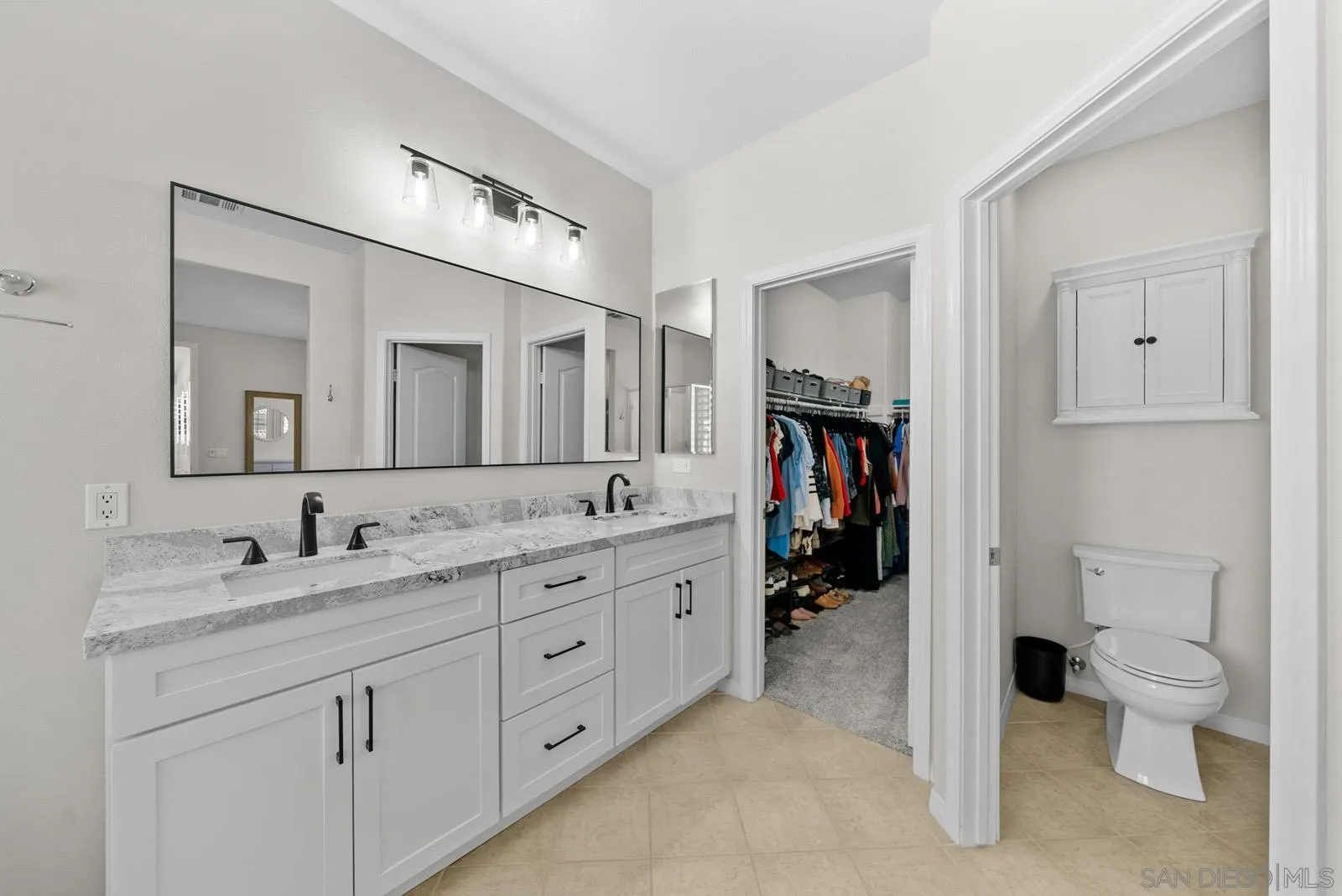 17083 Ralphs Ranch Road San Diego, CA 92127 - Photo 36 of 61 a spacious bathroom with a double vanity sink toilet and shower