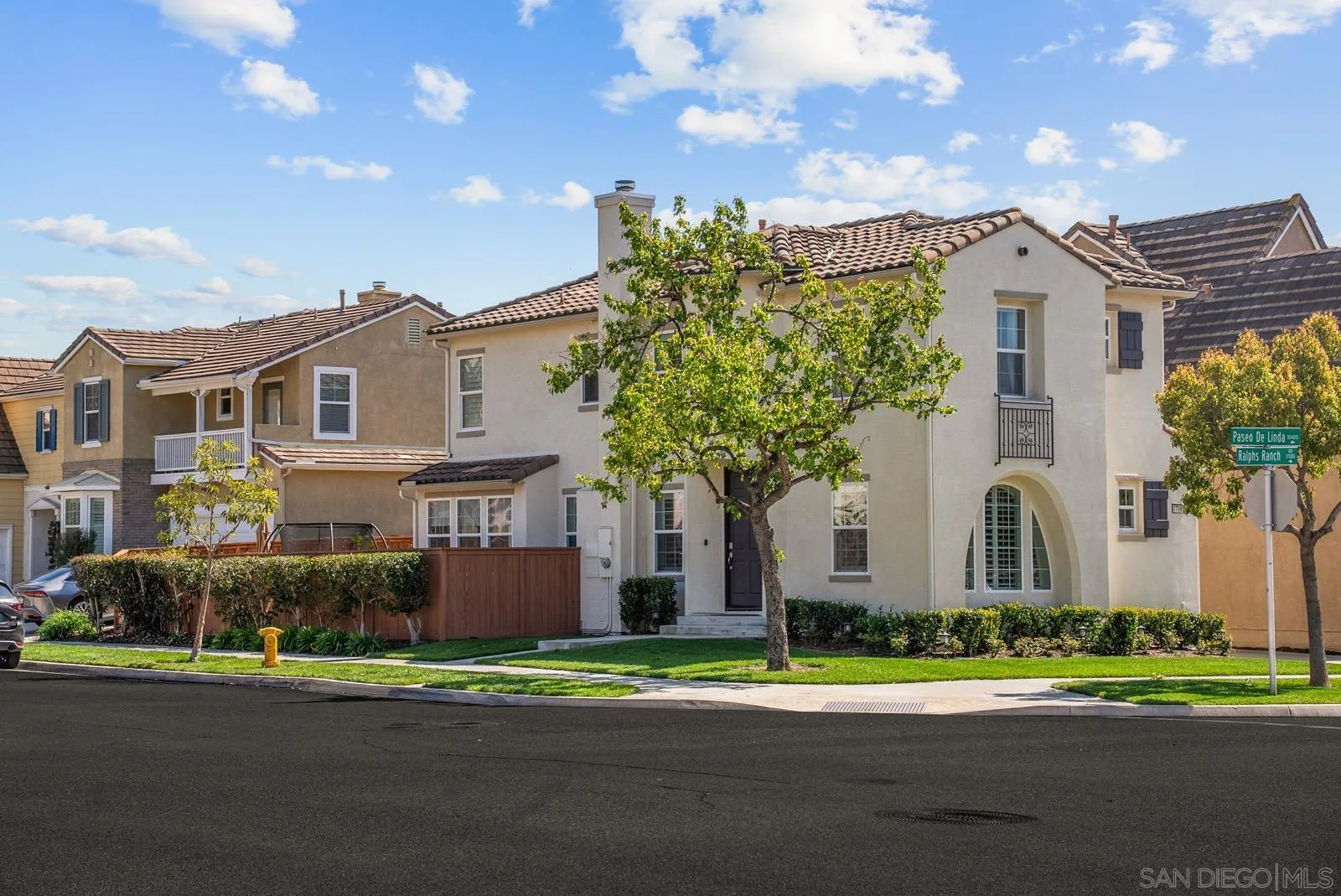 17083 Ralphs Ranch Road San Diego, CA 92127 - Photo 52 of 61 a front view of a house with a garden and plants