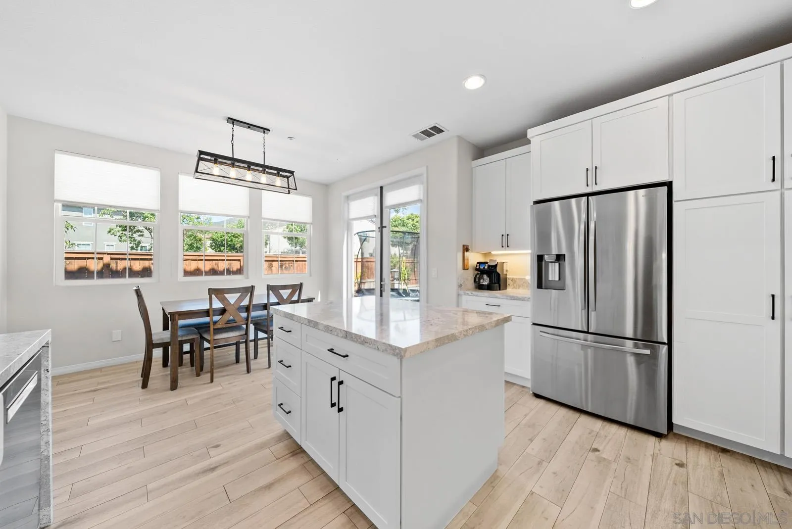 17083 Ralphs Ranch Road San Diego, CA 92127 - Photo 9 of 61 a kitchen with stainless steel appliances granite countertop a refrigerator and a stove top oven