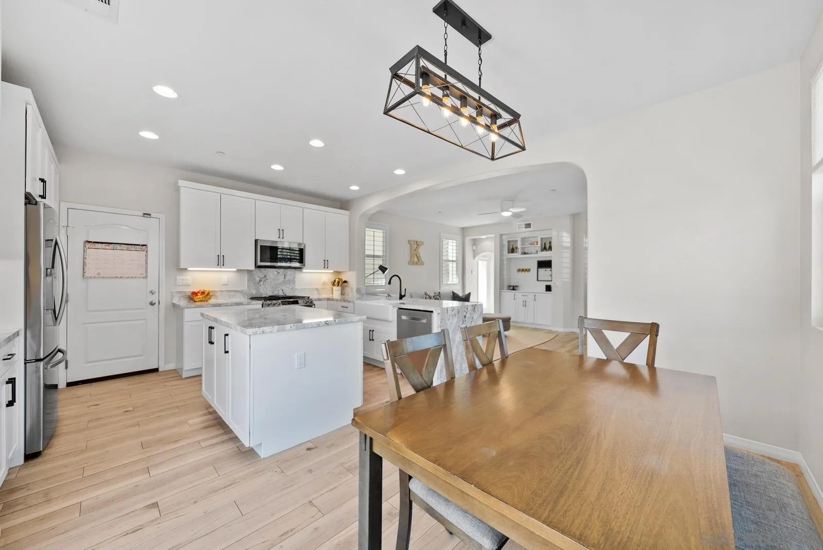 17083 Ralphs Ranch Road San Diego, CA 92127 - Photo 10 of 61 a kitchen with white cabinets and appliances
