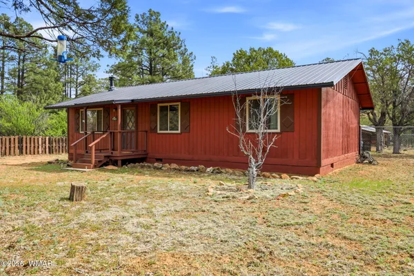 a house with trees in the background