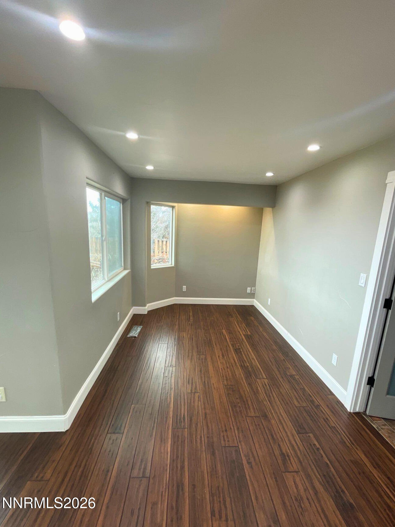 2205 Stowe Drive Reno, NV 89511 - Photo 8 of 17 an empty room with wooden floor and windows