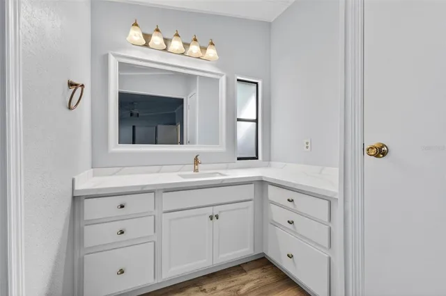 a bathroom with a double vanity sink and mirror