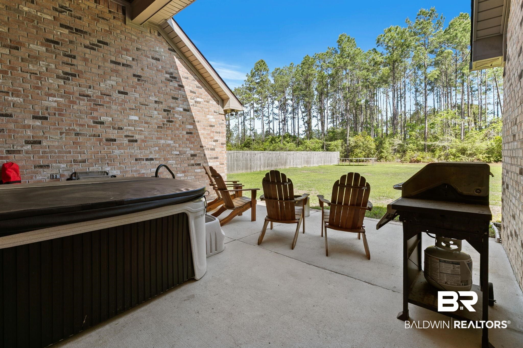 31911 Bobwhite Road Daphne, AL 36527 - Photo 50 of 85 View of patio / terrace with area for grilling and a hot tub