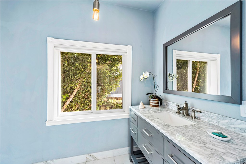 31004 Aliso Circle Laguna Beach, CA 92651 - Photo 15 of 28 a bathroom with a granite countertop sink and a window