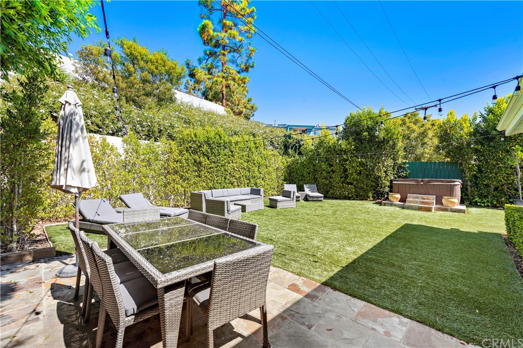 31004 Aliso Circle Laguna Beach, CA 92651 - Photo 23 of 28 a view of a backyard with table and chairs and potted plants