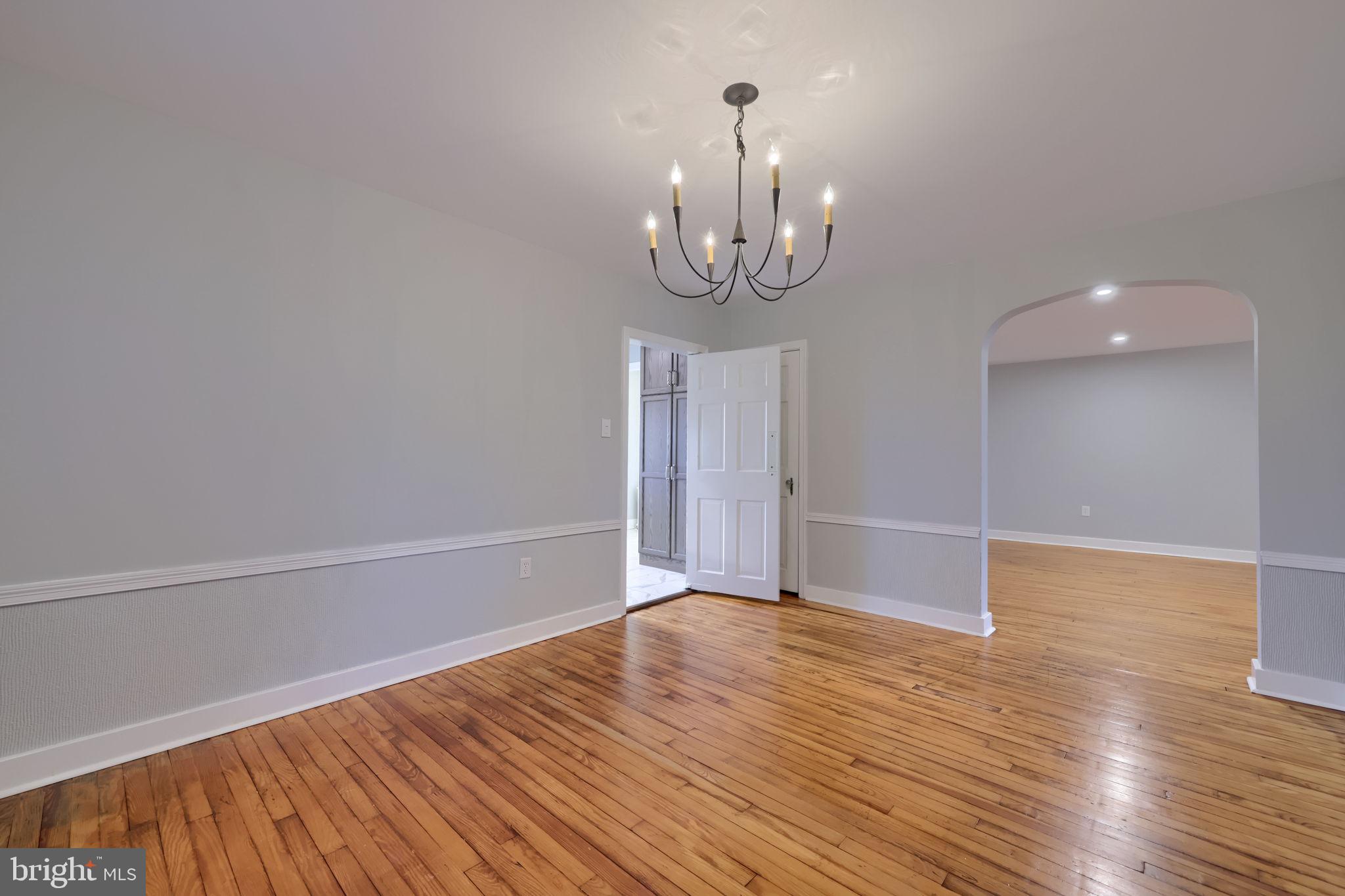 145 Weaver Road Lancaster, PA 17603 - Photo 41 of 87 a view of empty room with wooden floor and chandelier