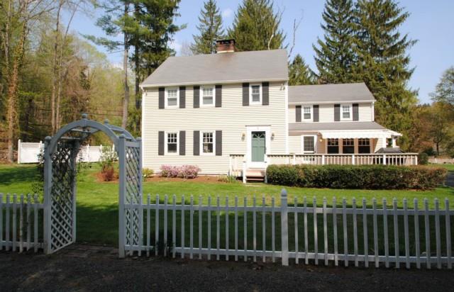 22 Old Redding Road Ridgefield, CT 06877 - Photo 1 of 1 a front view of a house with a garden