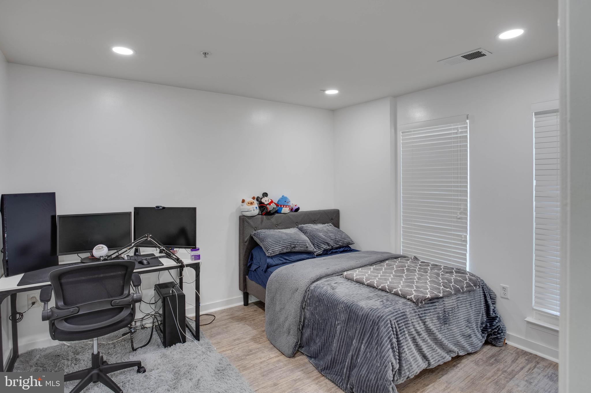 1049 Gardenview Loop, Unit 201 Woodbridge, VA 22191 - Photo 11 of 16 a bedroom with a bed and a desk