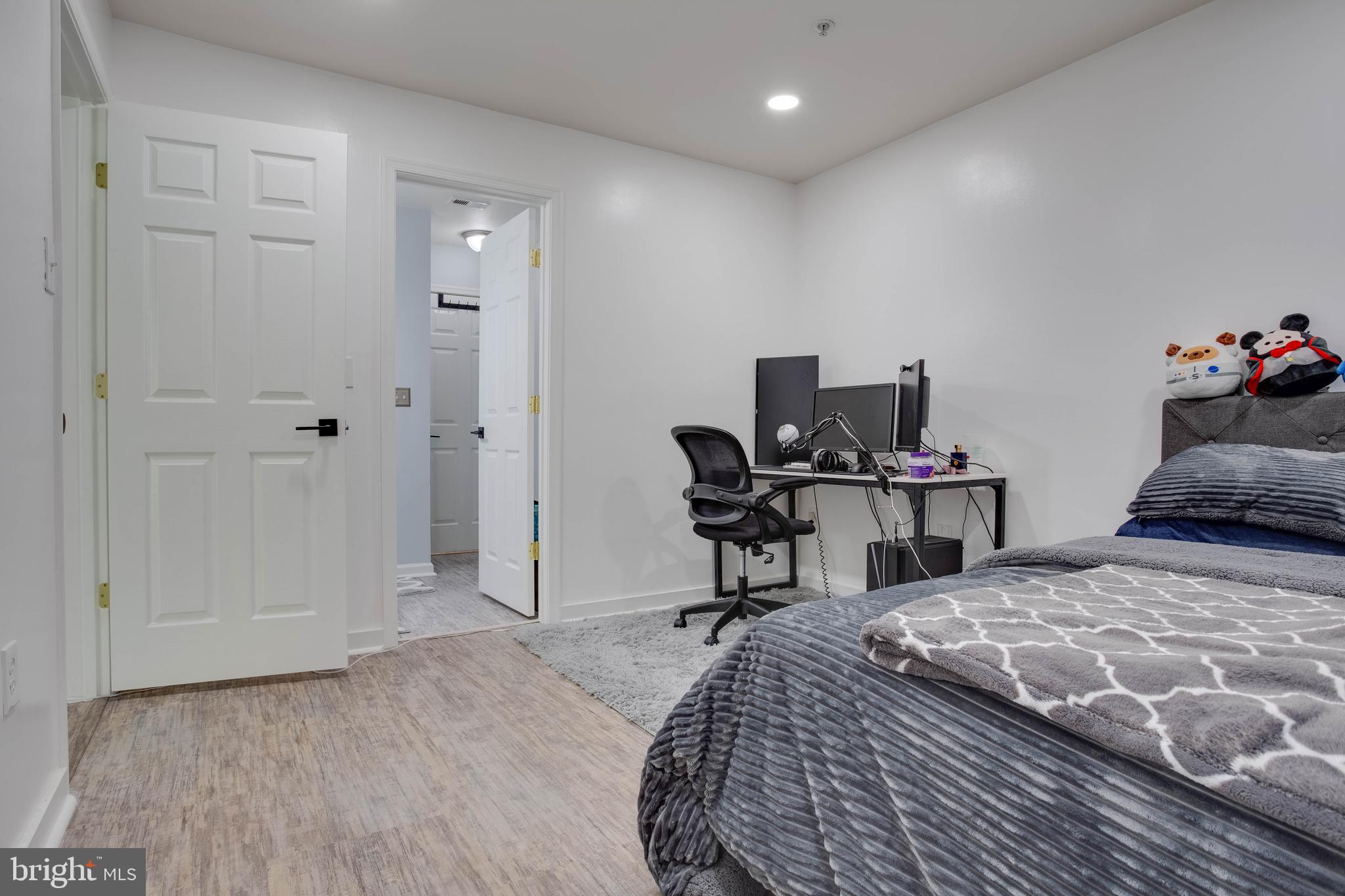 1049 Gardenview Loop, Unit 201 Woodbridge, VA 22191 - Photo 12 of 16 a bedroom with a bed and a desk