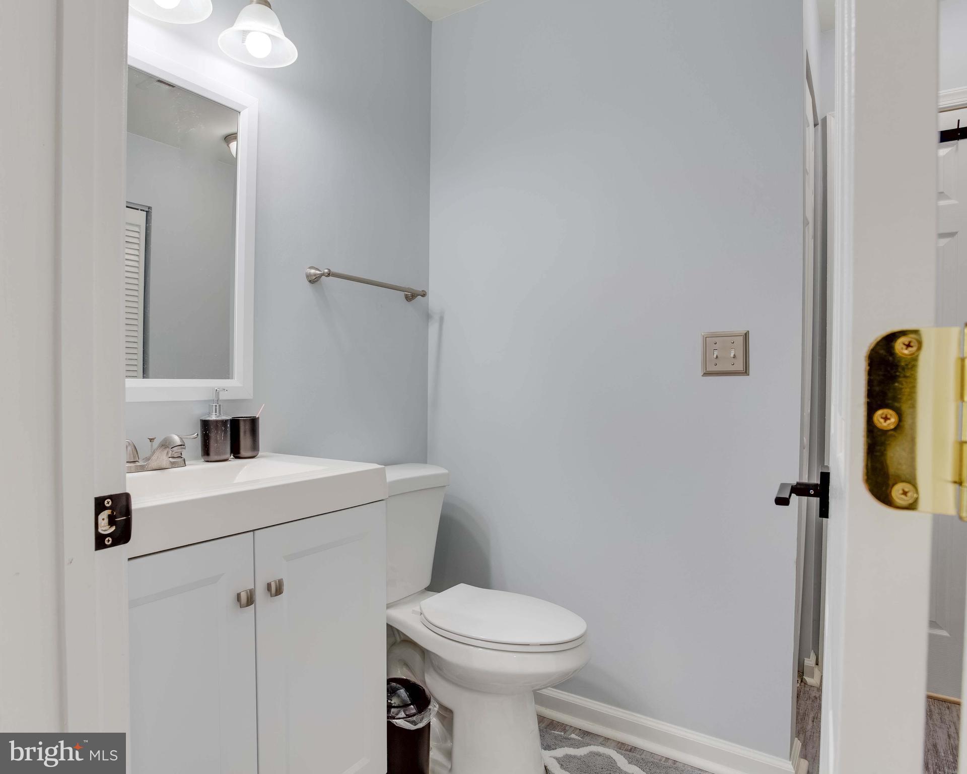 1049 Gardenview Loop, Unit 201 Woodbridge, VA 22191 - Photo 13 of 16 a bathroom with a sink toilet and shower