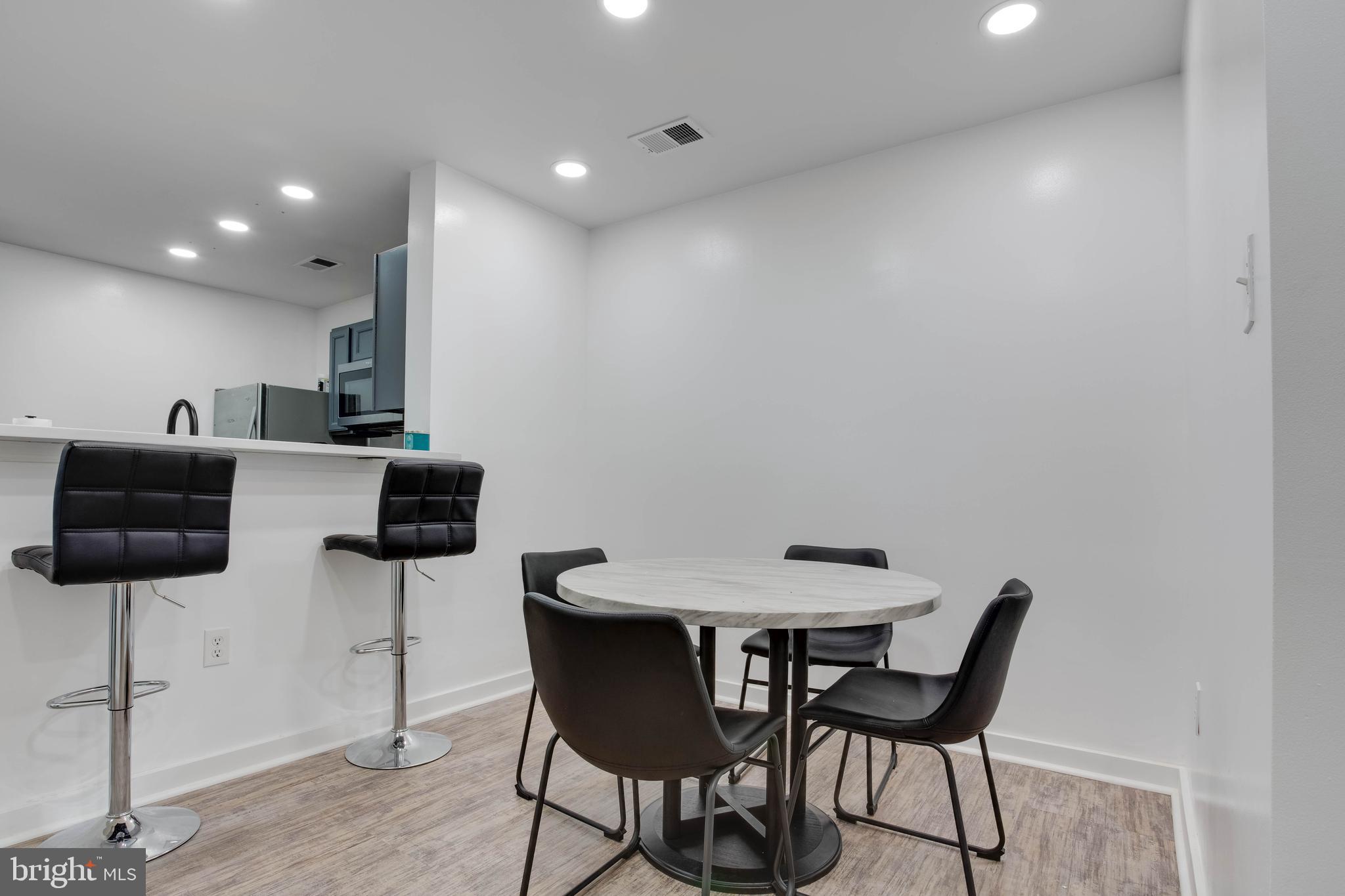 1049 Gardenview Loop, Unit 201 Woodbridge, VA 22191 - Photo 4 of 16 a view of a dining room with furniture