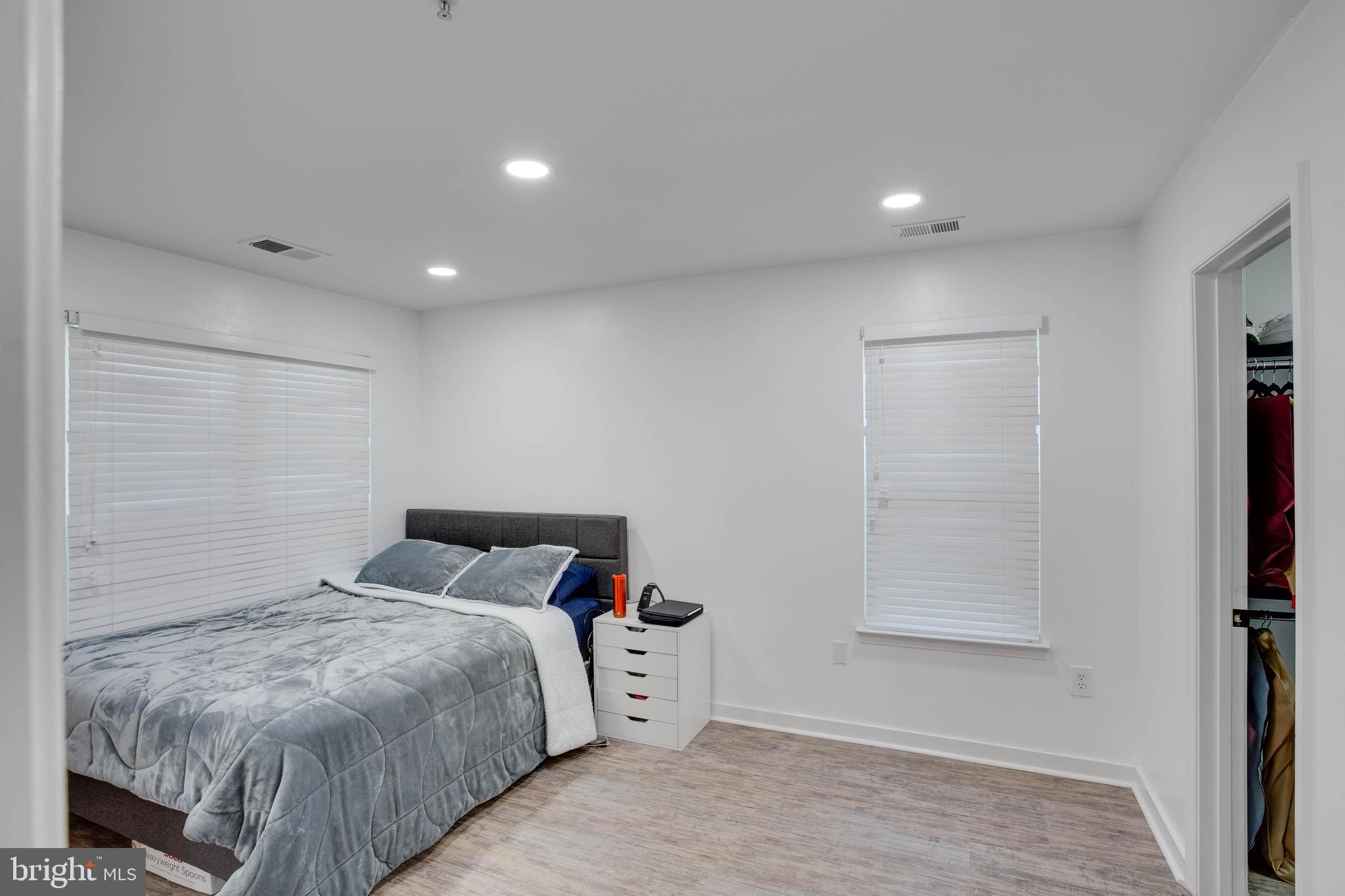 1049 Gardenview Loop, Unit 201 Woodbridge, VA 22191 - Photo 8 of 16 a bedroom with a bed and a window