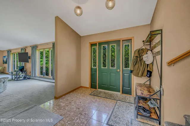 a kitchen with stainless steel appliances granite countertop a refrigerator a sink and a stove