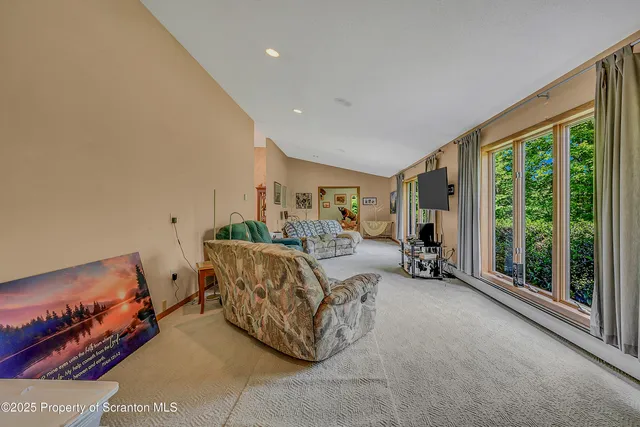 a kitchen with a stove a sink a center island and cabinets