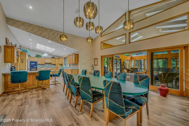 a spacious bedroom with a bed and a flat screen tv