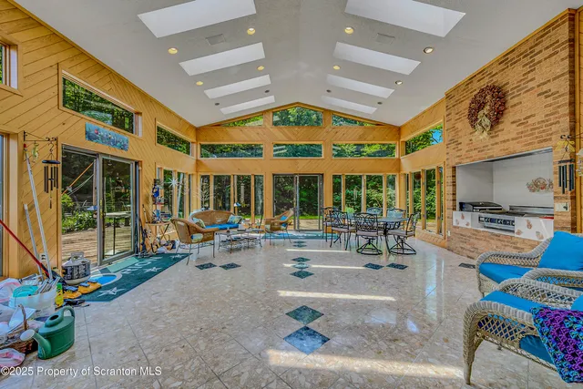 a spacious bathroom with a granite countertop sink and a mirror