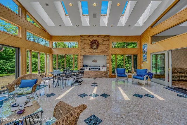a living room with furniture and a rug