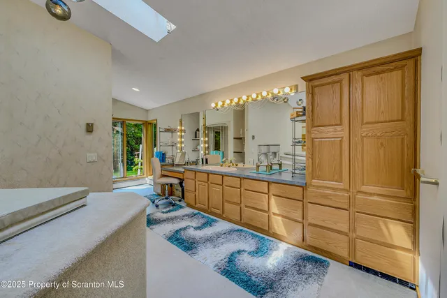 a view of a livingroom with furniture and windows