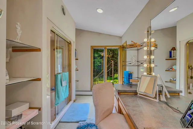 a view of workspace with furniture and windows