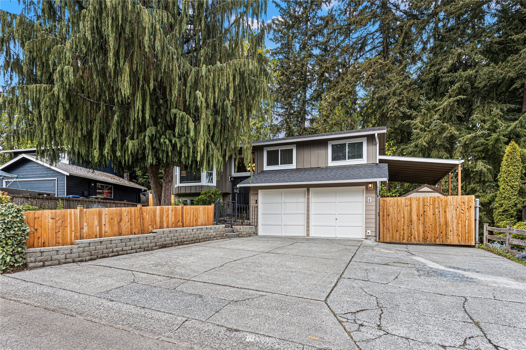 21330 2nd Avenue Southeast Bothell, WA 98021 - Photo 1 of 27 a backyard of a house with barbeque oven and trees