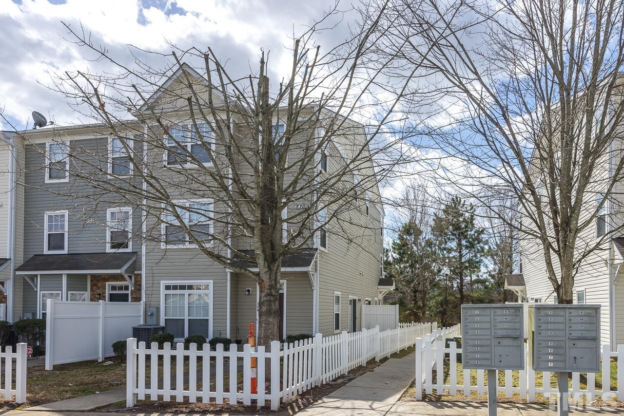 330 Gilman Lane, Unit 111 Raleigh, NC 27610 - Photo 2 of 26 a front view of a house with a trees
