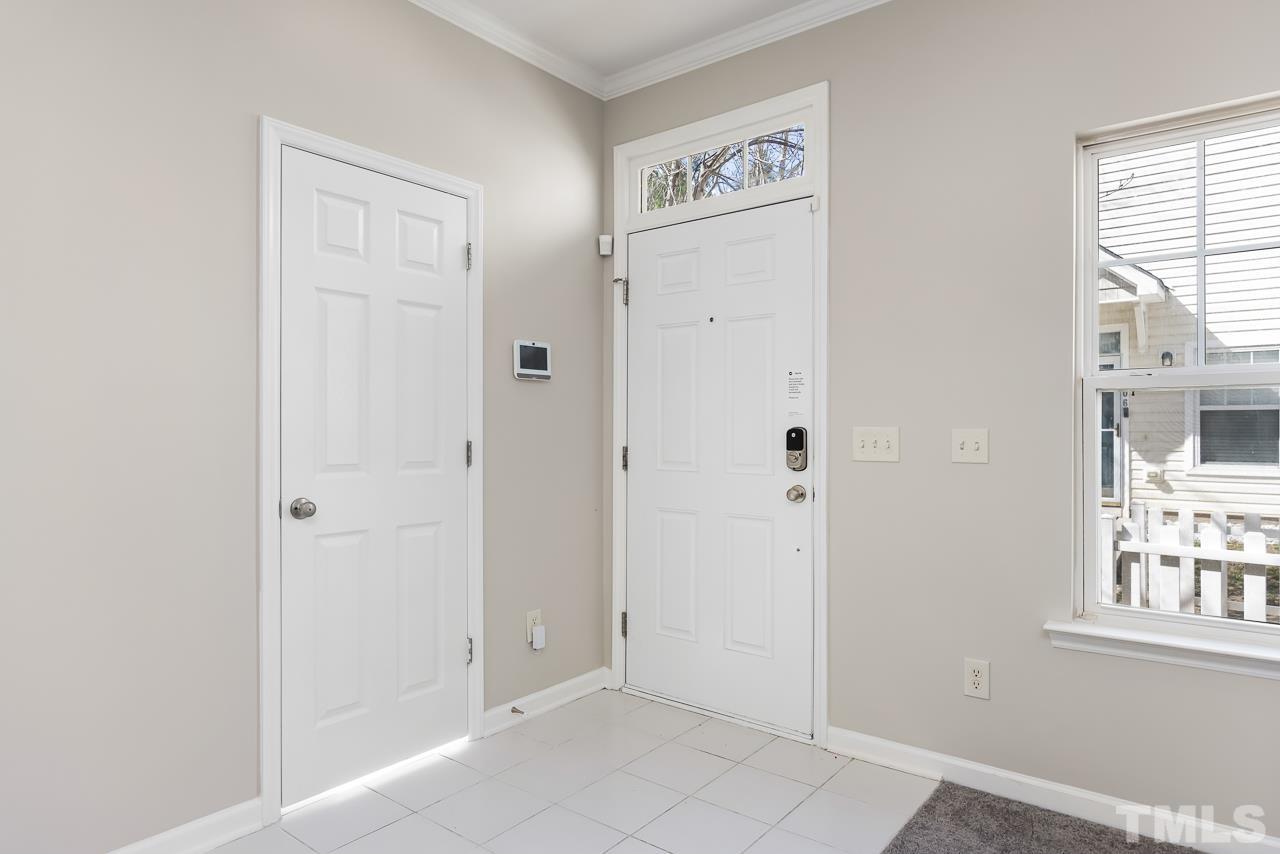 330 Gilman Lane, Unit 111 Raleigh, NC 27610 - Photo 4 of 26 an empty room with windows