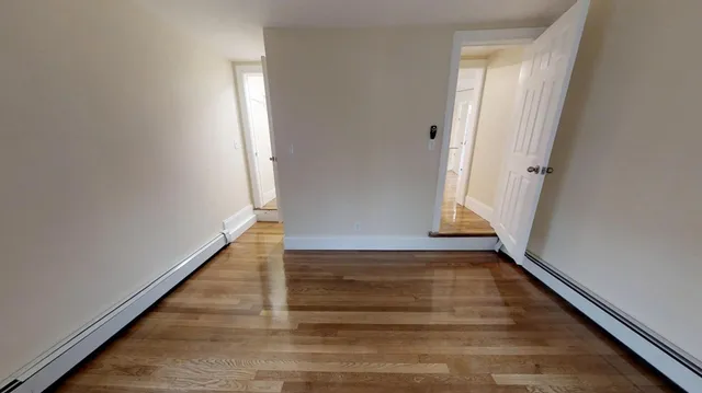 a view of entryway with wooden floor