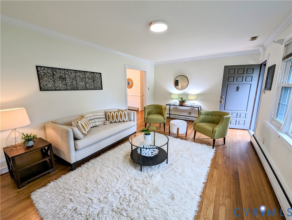 8401 Bronwood Road Henrico, VA 23229 - Photo 4 of 11 a living room with furniture and wooden floor