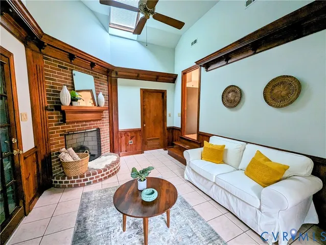 a living room with furniture and a clock