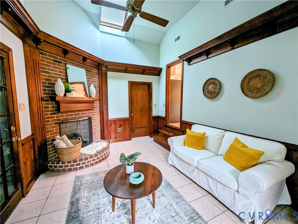 8401 Bronwood Road Henrico, VA 23229 - Photo 7 of 11 a living room with furniture and a clock